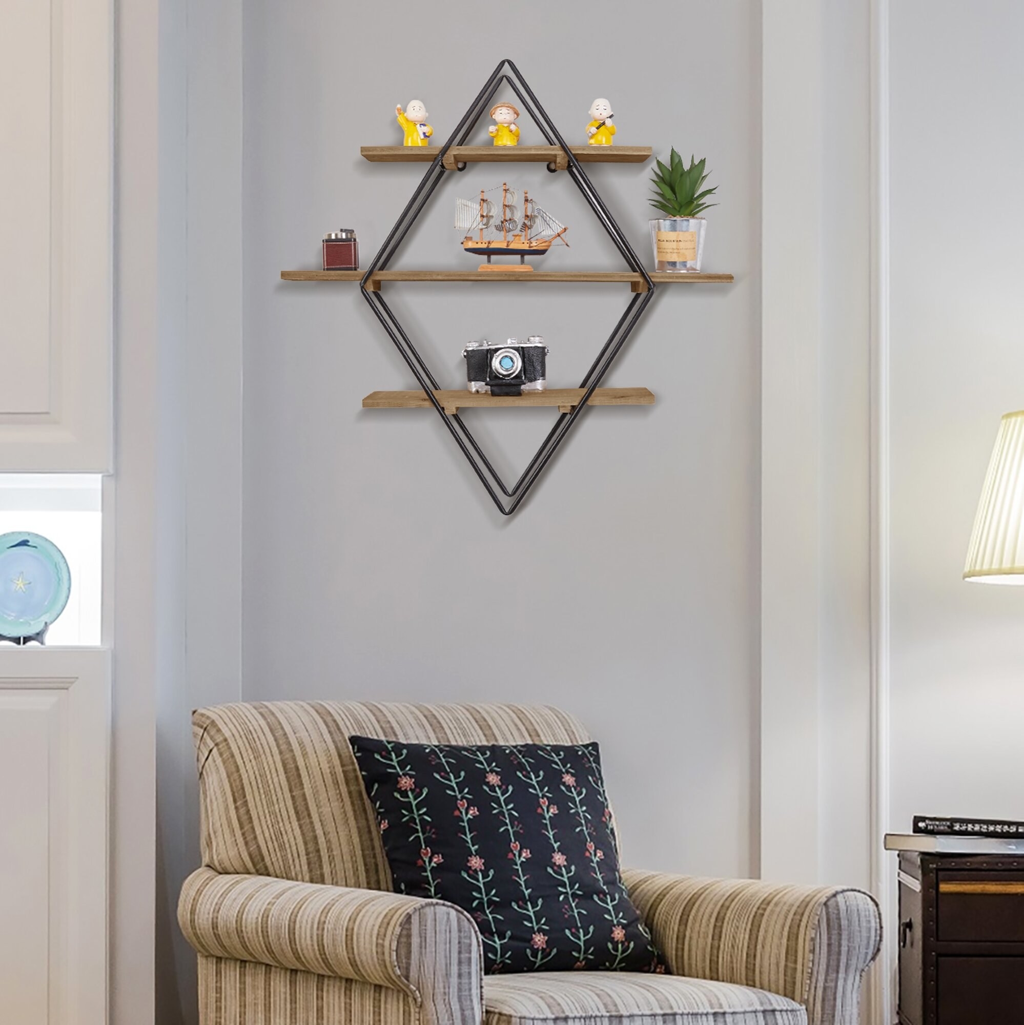 A diamond-shaped accent shelf mounted on a wall above a brown armchair 