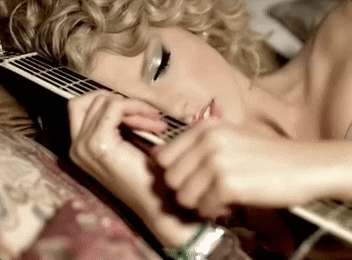a gif of taylor swift in the teardrops on my guitar music video
