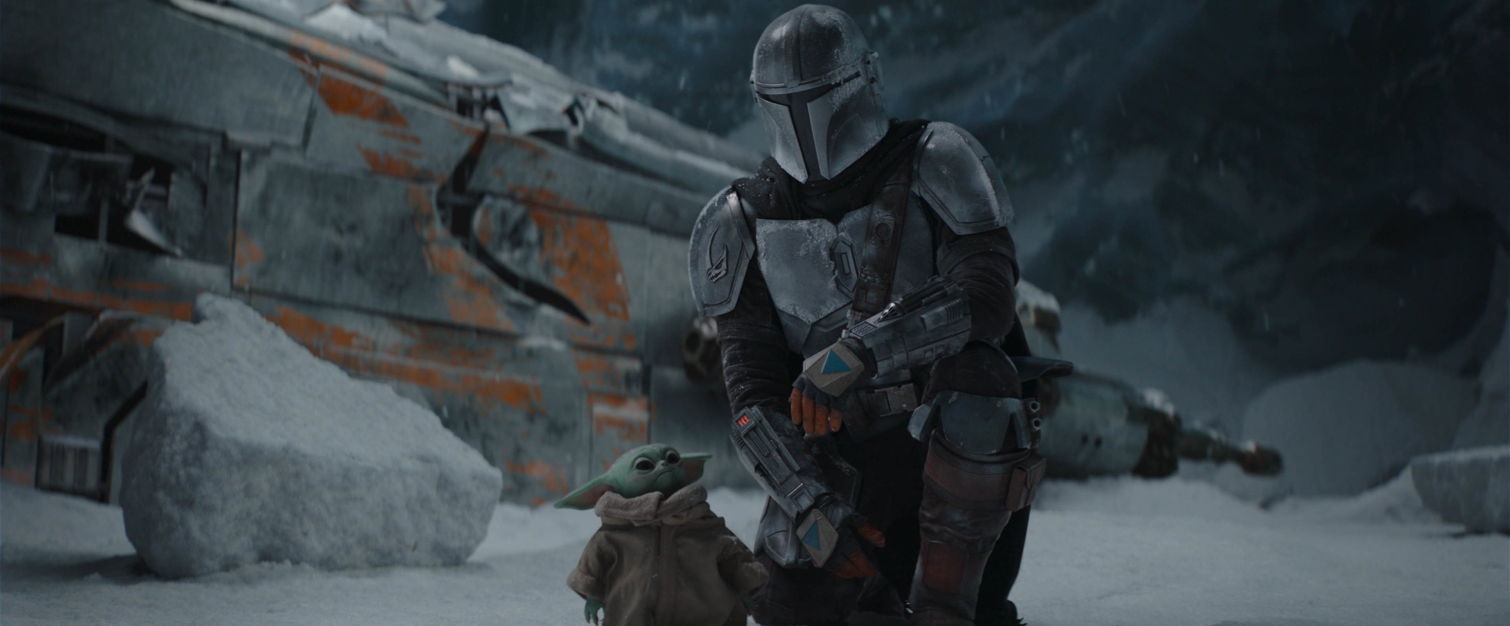 THE MANDALORIAN, from left: The Child (aka Baby Yoda), Pedro Pascal (as The Mandalorian)