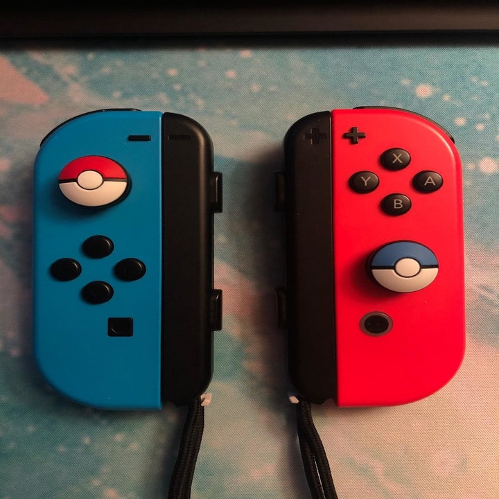 Amazon reviewer photo of joy-cons with Pokéball-themed joystick grips