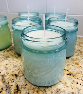 reviewer's candle in blue mason jar