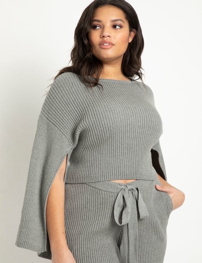model wears cropped ribbed sweater with split sleeves 