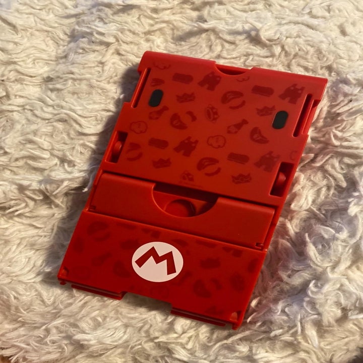 Reviewer photo of folded Nintendo Switch stand with Mario pattern