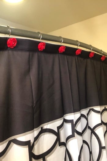 Same shower hooks above Grateful Dead-inspired shower curtain