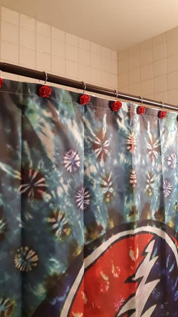 Same shower hooks above Grateful Dead-inspired shower curtain