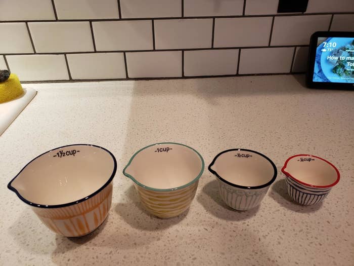 reviewer image of the four Creative Co-Op Hand Stamped Striped Stoneware Measuring Cups