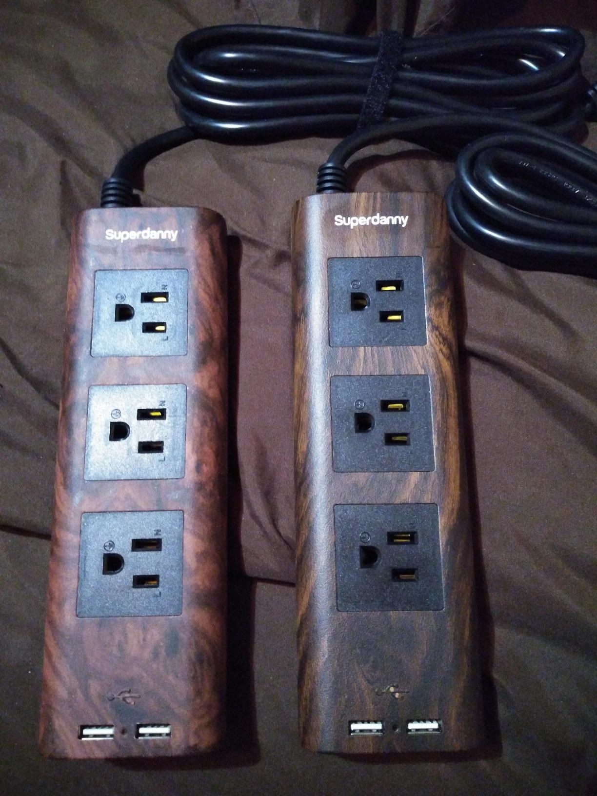 reviewer image of two wood grain surge protectors