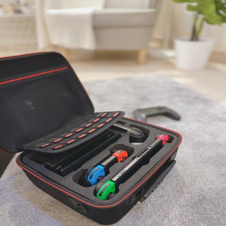 Reviewer photo Nintendo Switch case opened to reveal Nintendo Switch and various accessories