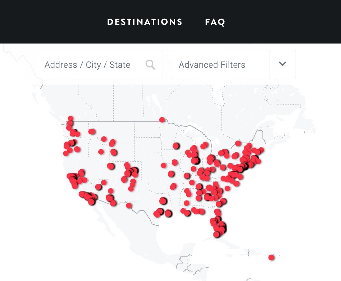 A screenshot of a map of the continental US with red dots indicating the location of hotels with Peloton bikes.