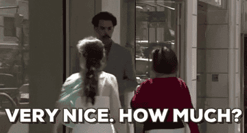 A GIF of Borat on the street telling a woman &quot;Very Nice. How Much?&quot;
