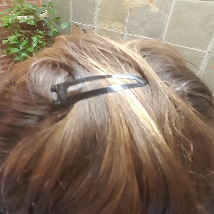 Reviewer wearing hair clip