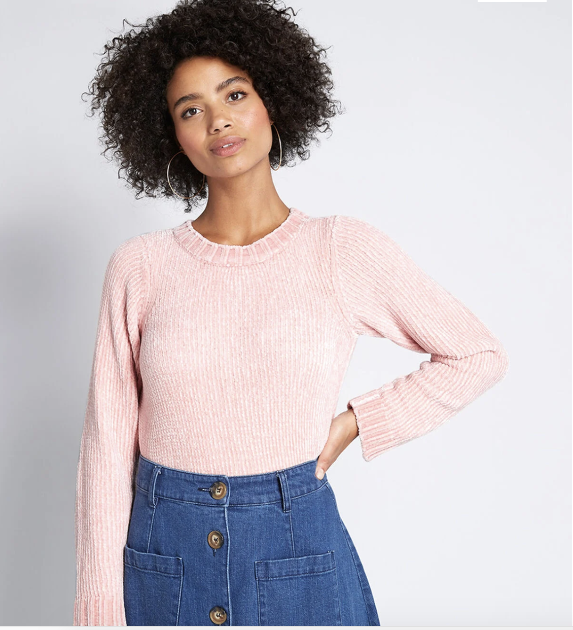 Model in ribbed blush pink chenille sweater 