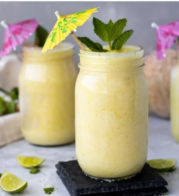 A handful of frozen piña coladas in mason jars.