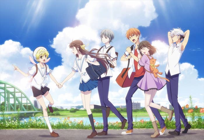 The characters of &quot;Fruits Basket&quot; walking along a pathway; they look happy and are smiling and laughing together