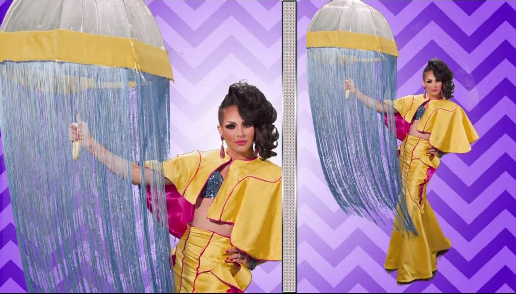 Drag queen April Carrion wearing a yellow bolero and fishtail skirt while holding a matching umbrella with blue fringe hanging from it