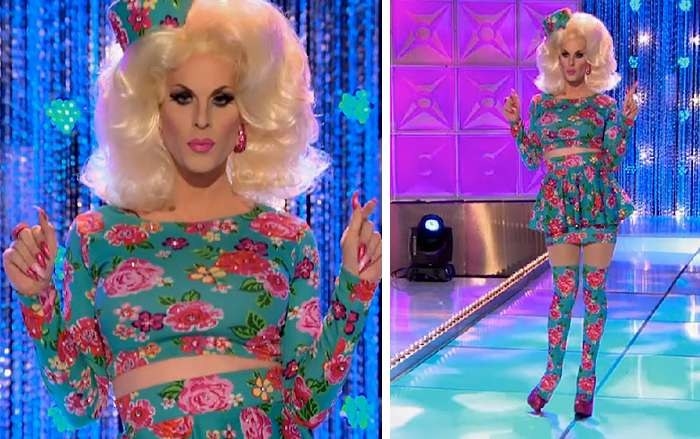 Drag queen Katyta wearing a teal floral top and skirt with matching pill box hat and thigh high socks