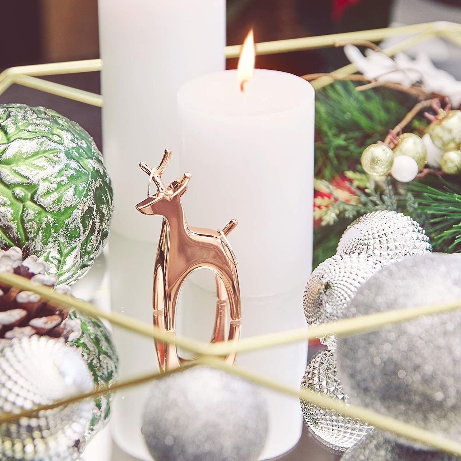The reindeer ring holder surrounded by ornaments