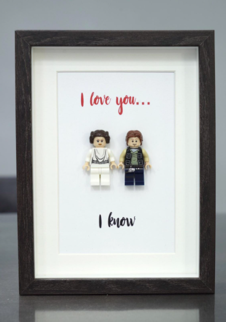 A pair of Han and Leia LEGO figures inside a frame surrounded by the text I love you...I know