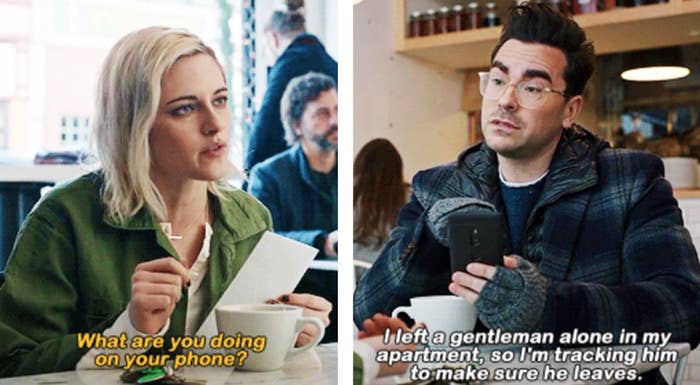 Kristen Stewart as Abby and Dan Levy as John in the movie "Happiest Season."