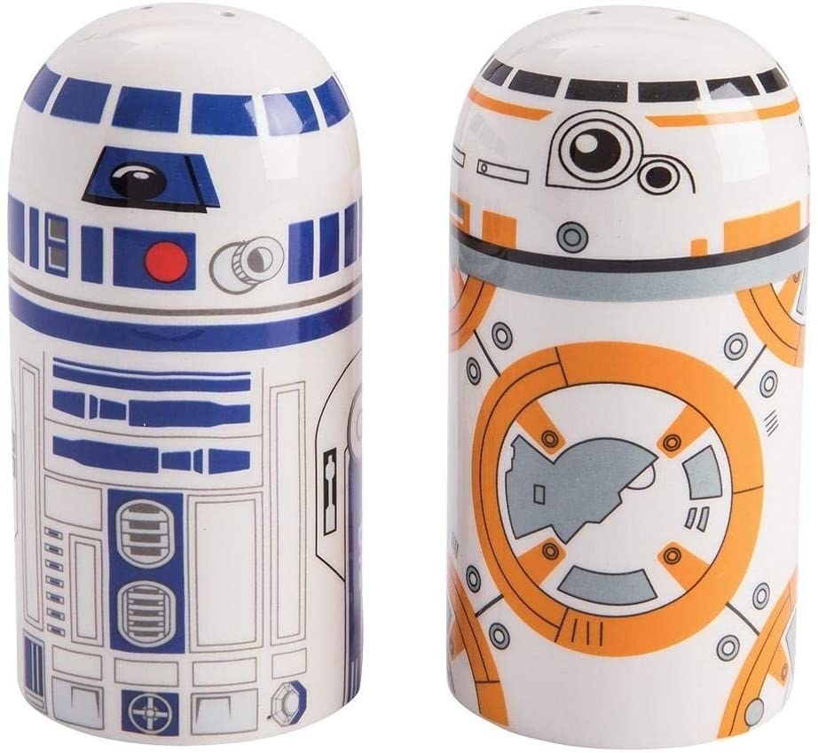 A pair of salt and pepper shakers shaped like R2D2 and BB8 from Star Wars