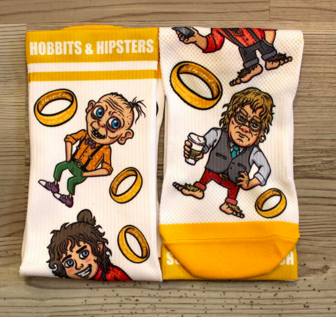 A pair of socks with hobbit characters and ring designs