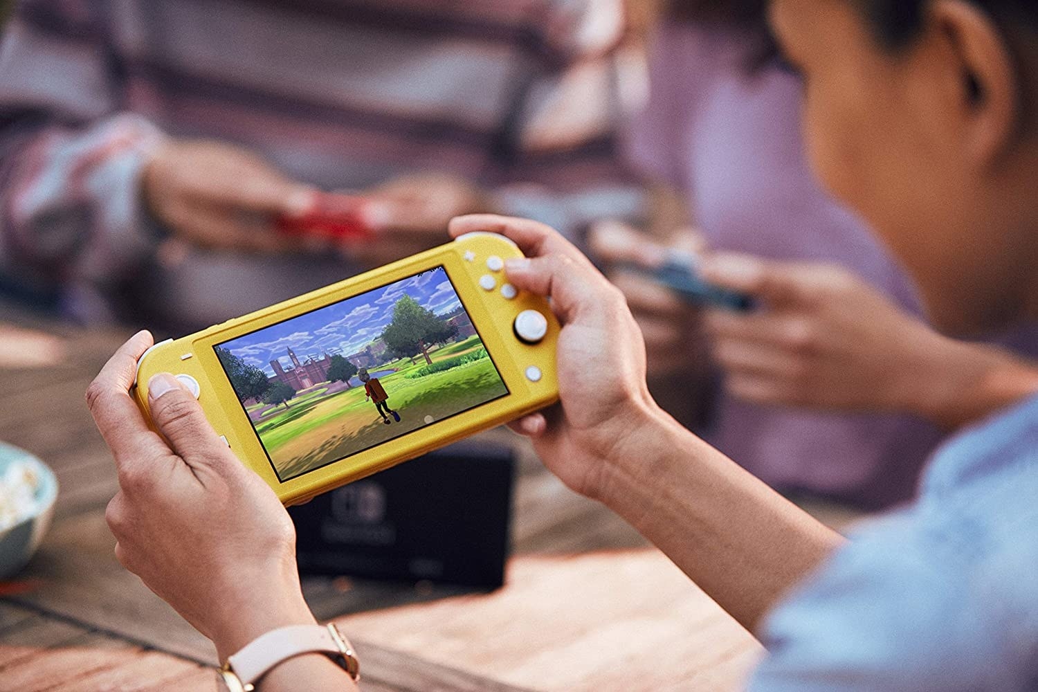 A person playing on the Nintendo Switch Lite