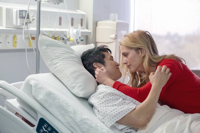 Jenn comforting Sol in his hospital bed