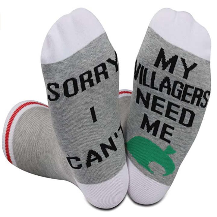 A pair of socks that say sorry I can't my villagers need me on the bottom