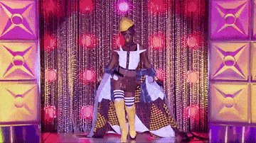 Drag queen Shea Couleé in a modern couture outfit inspired by the construction worker from the Village People