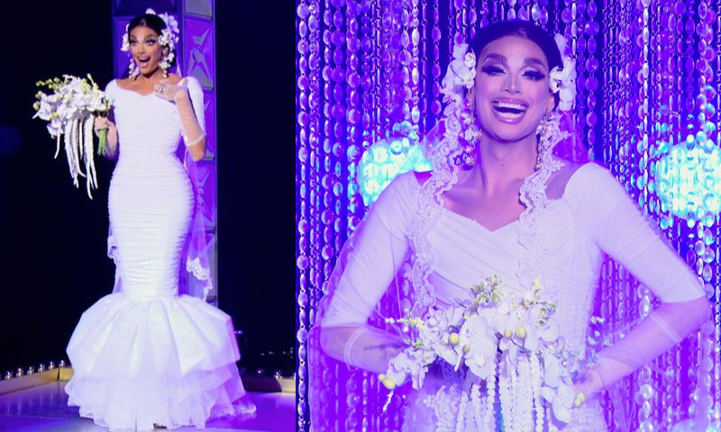 Drag queen Valentina wearing a figure-hugging wedding gown with a fishtail skirt and lace veil