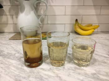 Three glasses of dirty water, then slightly clearer water, then almost completely clear