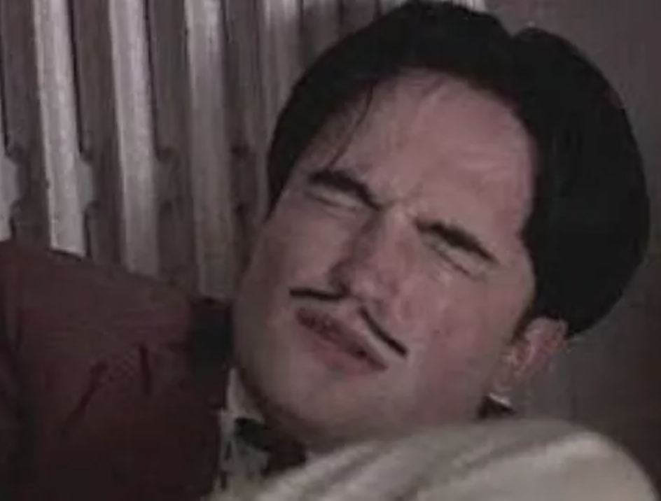 Pattinson as Dali masturbates with eyes shut tightly