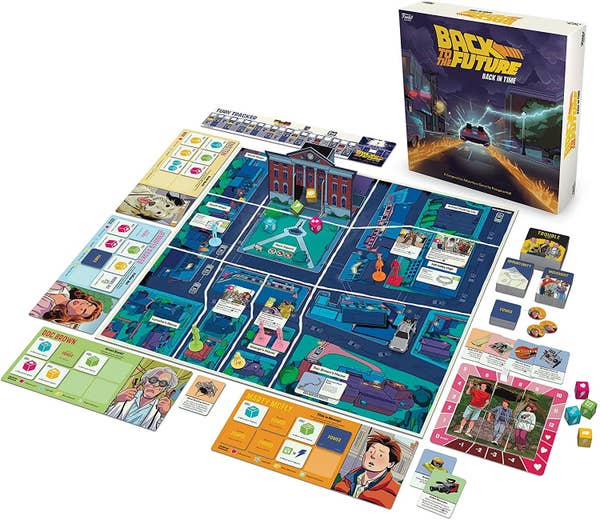 A game board featuring cartoon drawings of the Hill Valley town square, Marty McFly, Doc Brown, as well as game pieces like the DeLorean time machine and dice