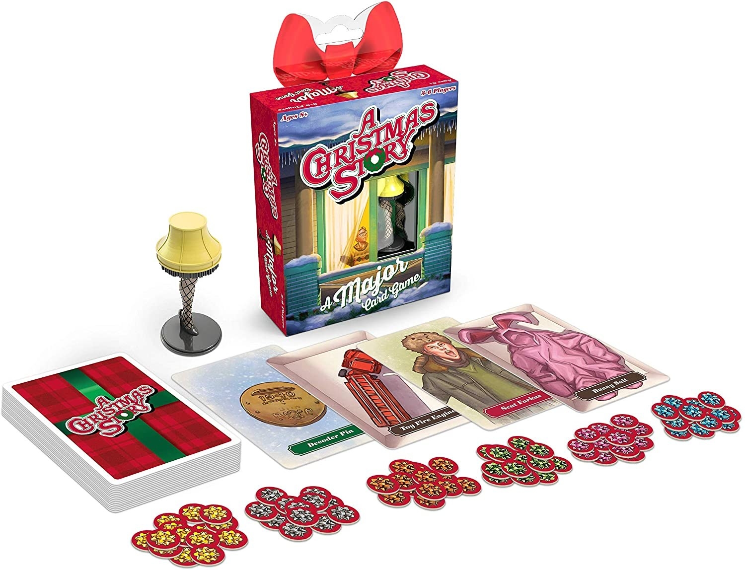 A small box with cards, chips, and a mini leg lamp from A Christmas Story