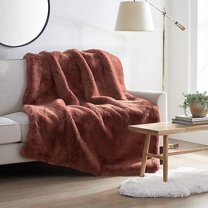an orange plush throw blanket