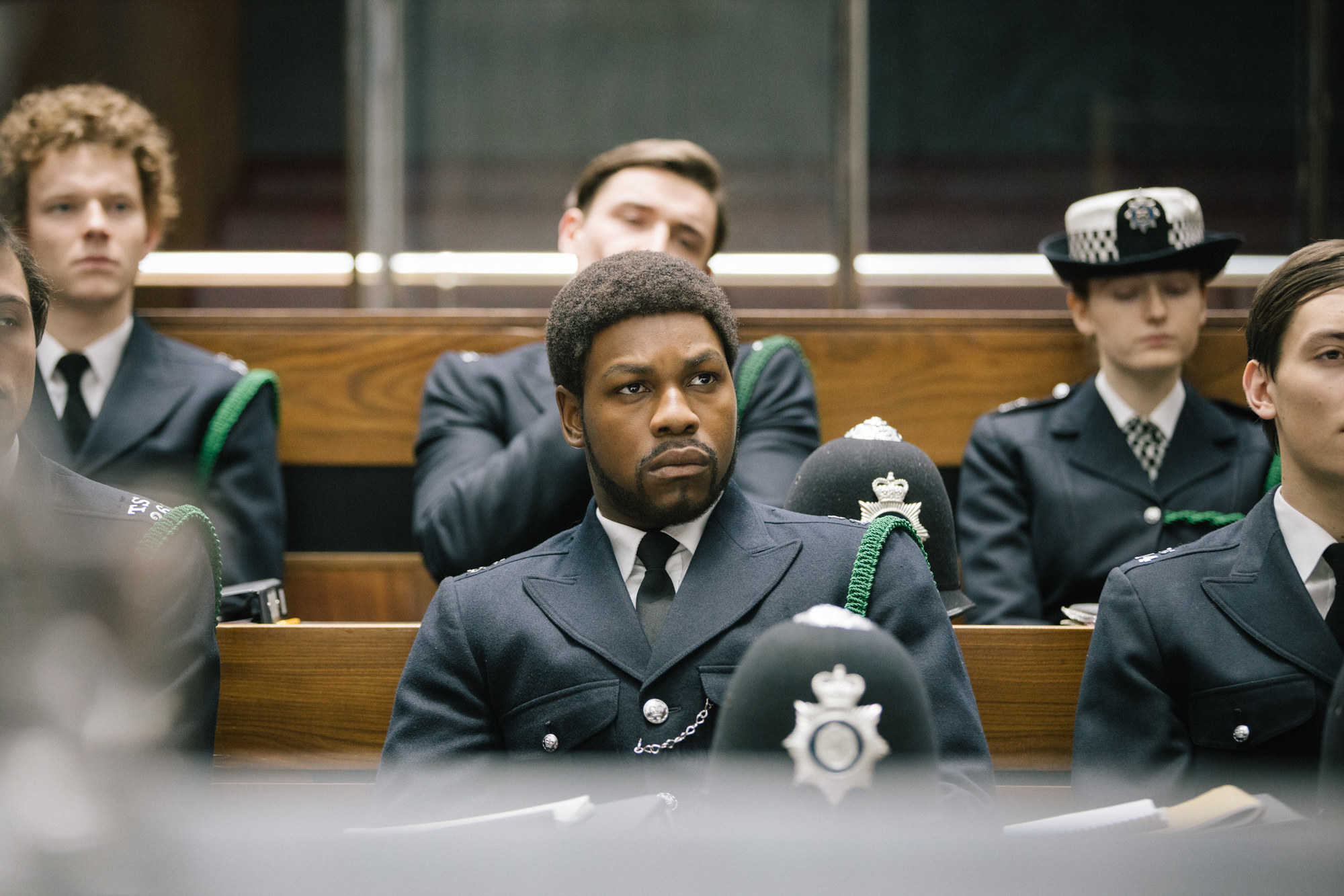 John Boyega dressed in a cop uniform in a scene from &quot;Red, White and Blue&quot;