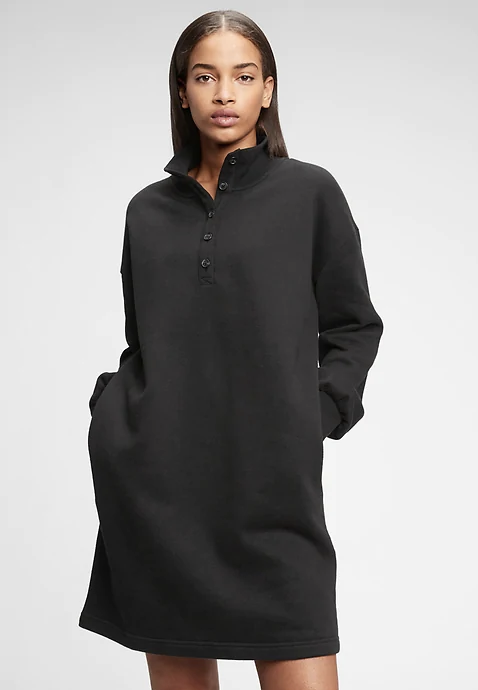 model wears sweatshirt-like shift dress with collar and four buttons