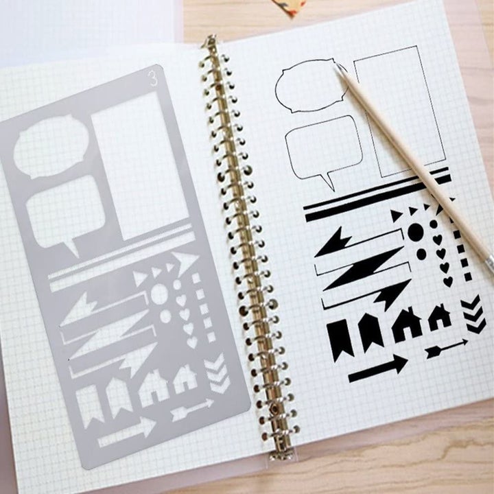 A stencil placed on a open notebook