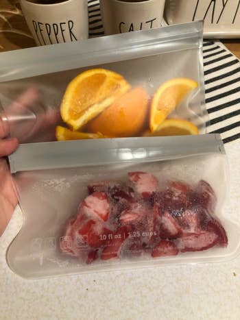 A different reviewers photo of two bags holding slices of oranges and frozen fruit