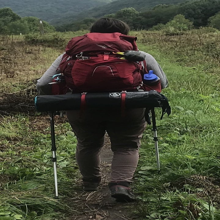 the writer walking with the trekking poles
