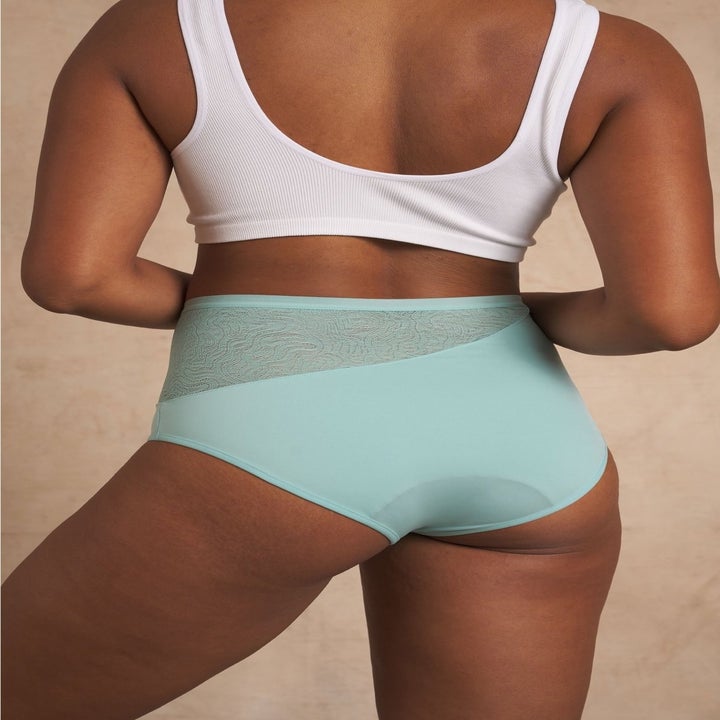 a different model showing the back of the lace underwear