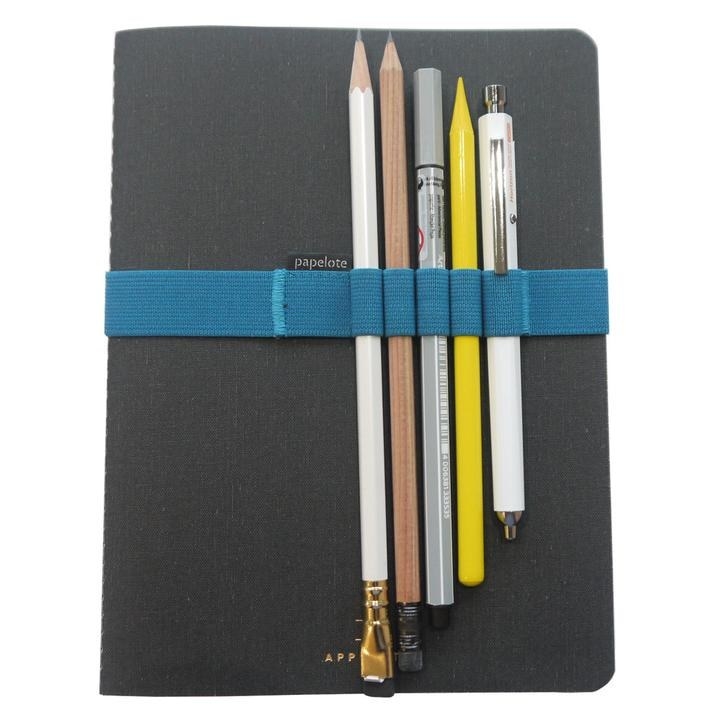 plain black notebook with elastic strap that fits over it that holds writing utensils 