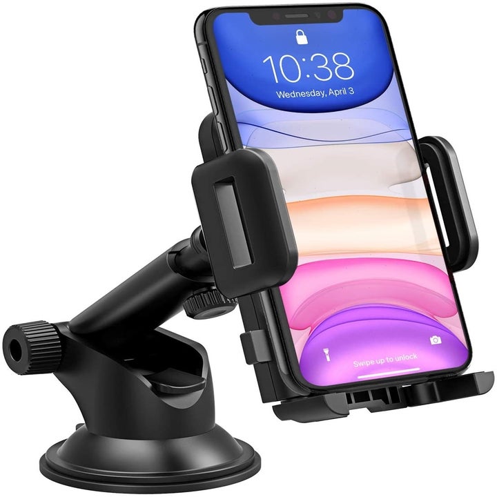 A phone mount with a cellphone in between the clamps