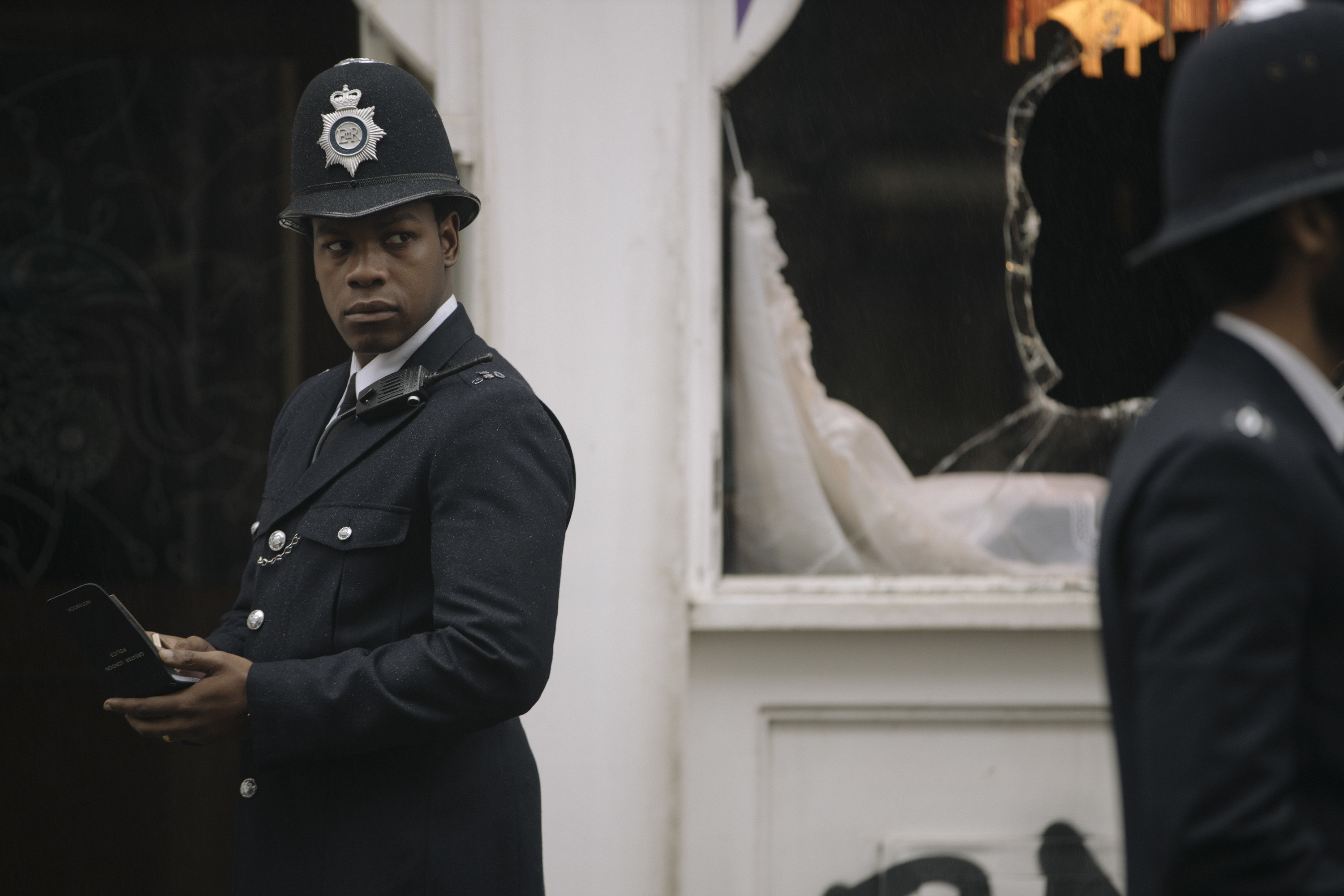 John Boyega dressed in a cop uniform in a scene from &quot;Red, White and Blue&quot;