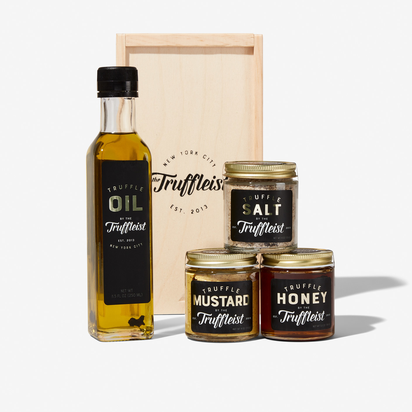 Bottles of truffle oil, truffle mustard, truffle salt and truffle honey