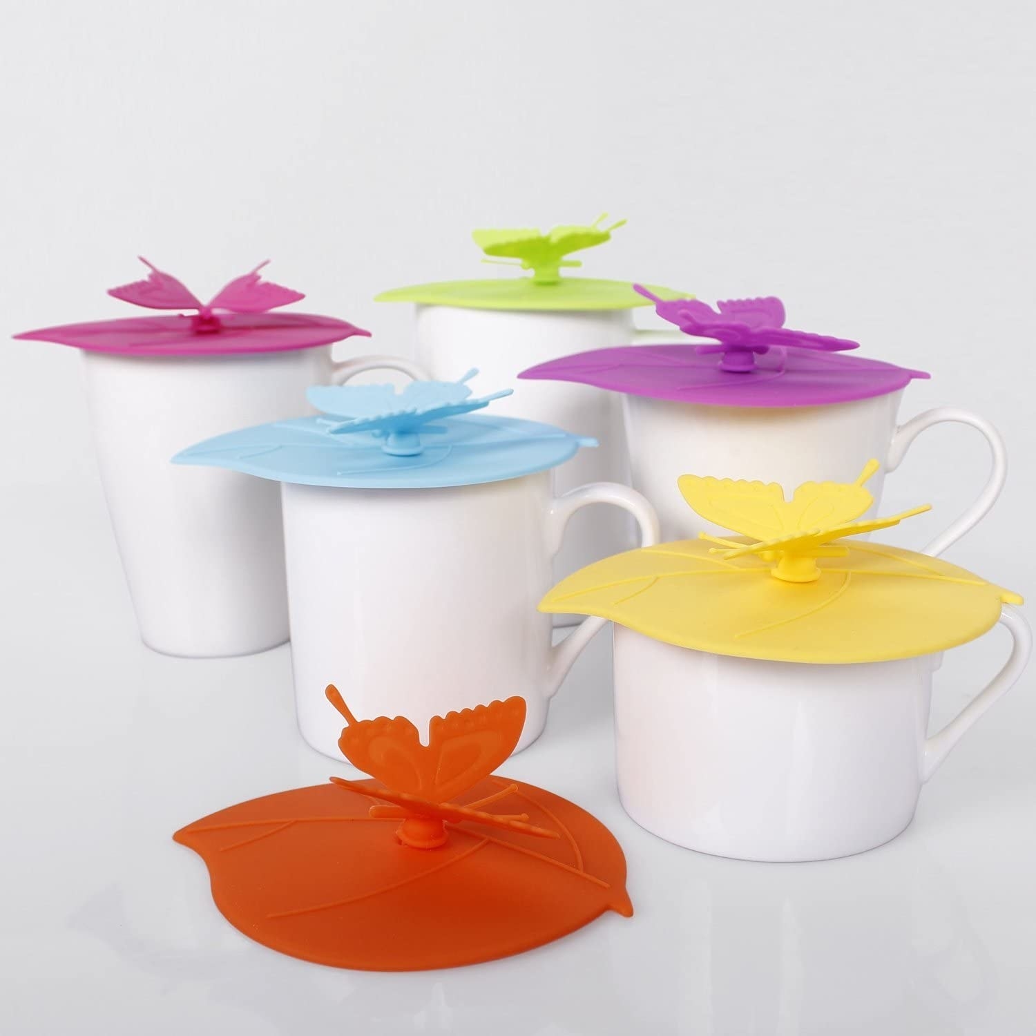 Several silicone lids on mugs