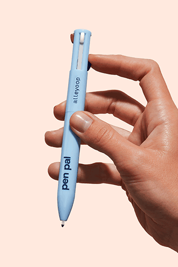 A GIF of a hand pressing down to release the slim eyeliner tip