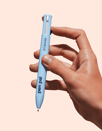 A GIF of a hand pressing down to release the slim eyeliner tip