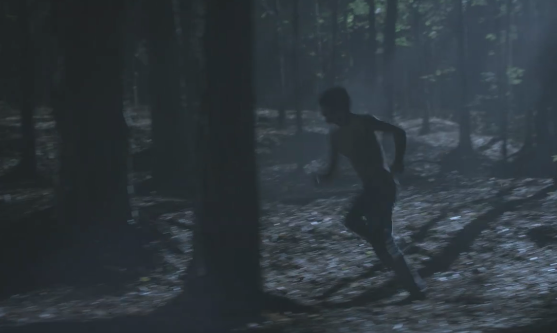 Scott running away from hunters in the woods