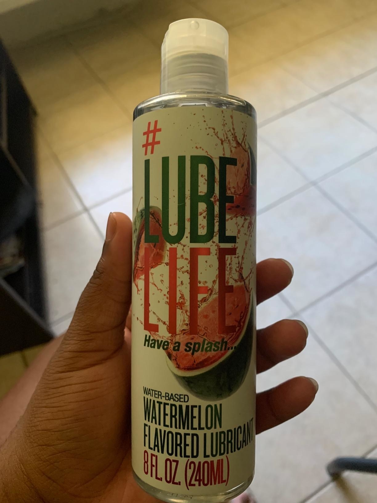 reviewer image of the watermelon lube life lubricant in a customer&#x27;s hand